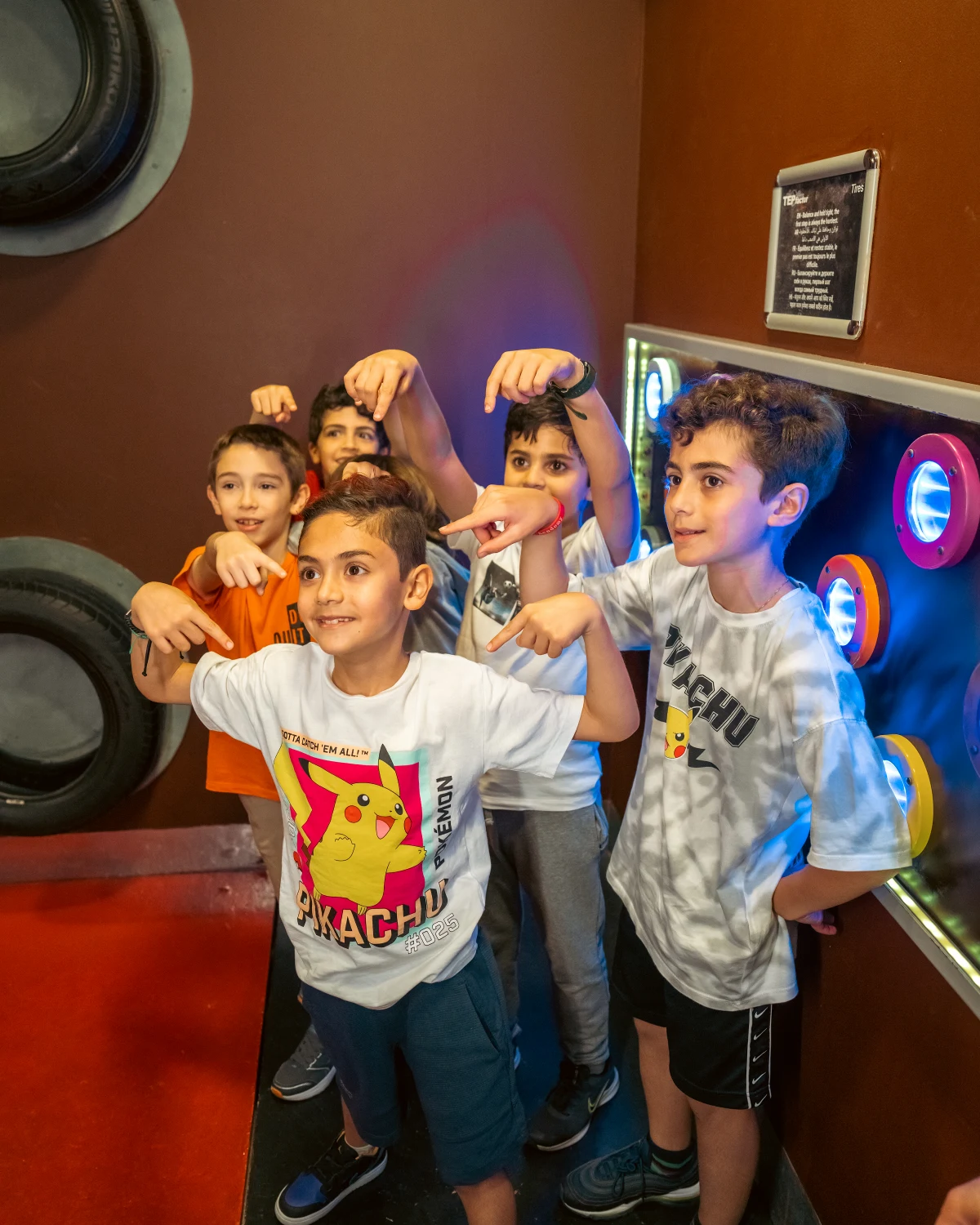 Kids celebrating indoors at TEPfactor, a cool escape from Dubai summer heat